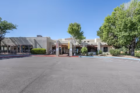 Brookdale Santa Fe senior living facility exterior with parking lot and trees