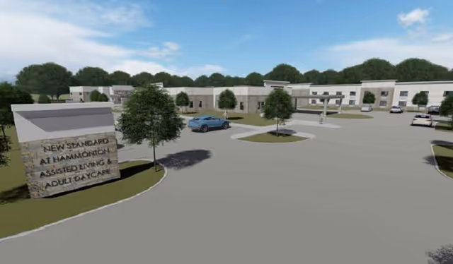 Exterior rendering of New Standard Senior Living at Hammonton with sign and parking.