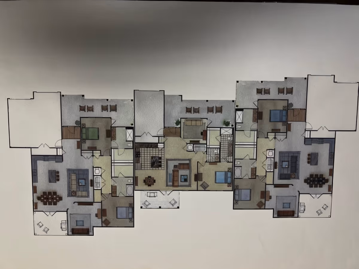 Architectural floor plan layout showing multiple apartment units with bedrooms, bathrooms, kitchens, living rooms, dining areas, and outdoor patios.