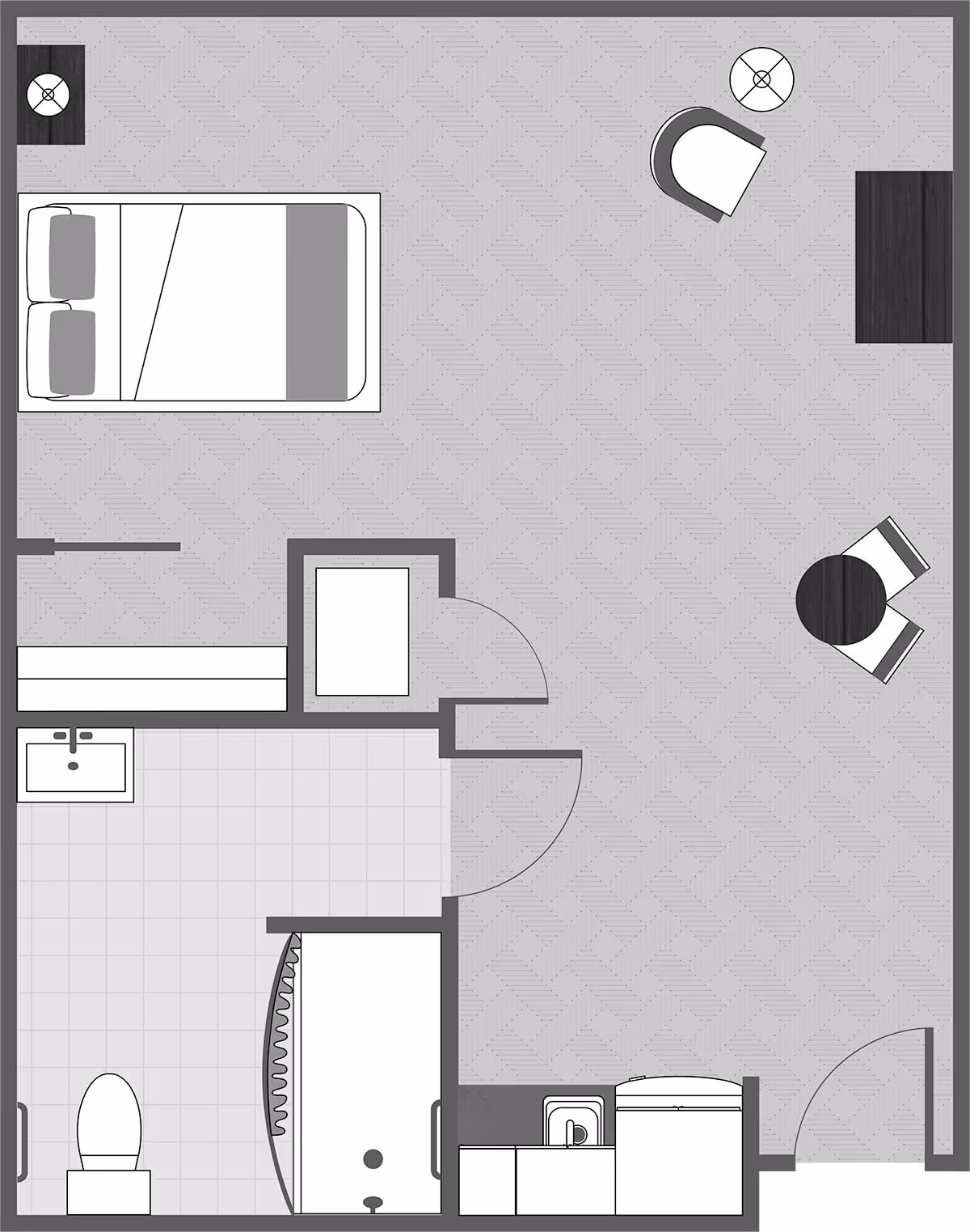 Top-down floor plan of a studio apartment showing a bed, bathroom with shower and toilet, kitchenette, and living/dining area with seating and table.