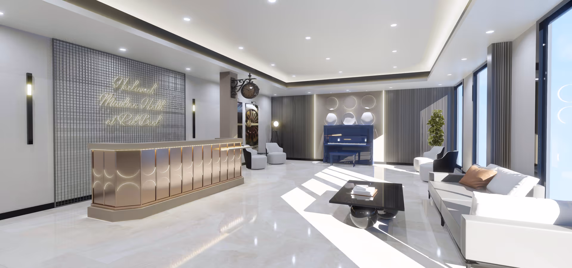 A spacious and modern reception area with a sleek front desk on the left side, a sign on the wall reading 'Welcome to Mirabella Valley at RedBank,' and a bright seating area on the right with white sofas, a black coffee table, and large windows letting in natural light. A piano and decorative elements are visible in the background.
