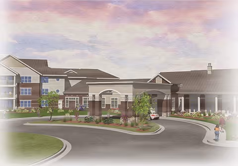 Exterior view of a large senior living facility building with a covered entrance driveway, landscaped greenery, and a few people walking near the entrance under a partly cloudy sky.