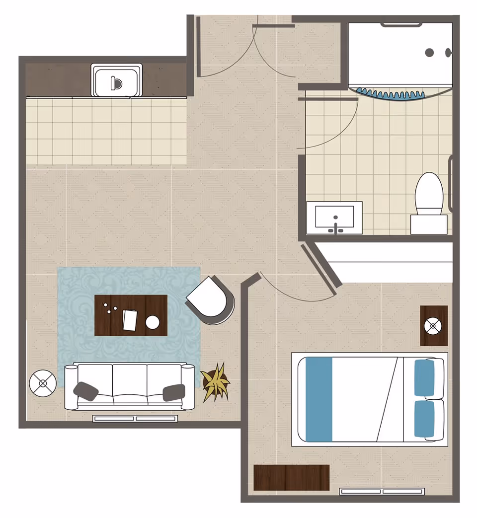 Top-down floor plan of a small assisted living unit showing a living room with a sofa, coffee table, chair, side table, and plant; a bedroom with a bed, nightstand, and dresser; a bathroom with a sink, toilet, and shower; and a small kitchen area with a sink.