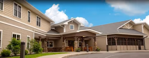 Exterior view of Valley Residential Services facility with a covered entrance and parking area