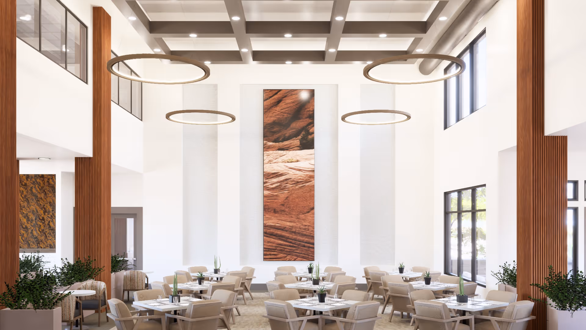 Bright, modern high-ceiling dining room with multiple tables and chairs, circular hanging lights, tall wooden columns, and a large vertical wall artwork.