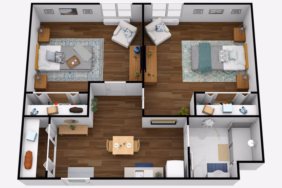 3D floor plan of a senior living apartment at The Rivers at Puyallup showing two bedrooms, a living area with two chairs and a TV, a dining area with a table and two chairs, a kitchen, and a bathroom with a shower, toilet, and sink.