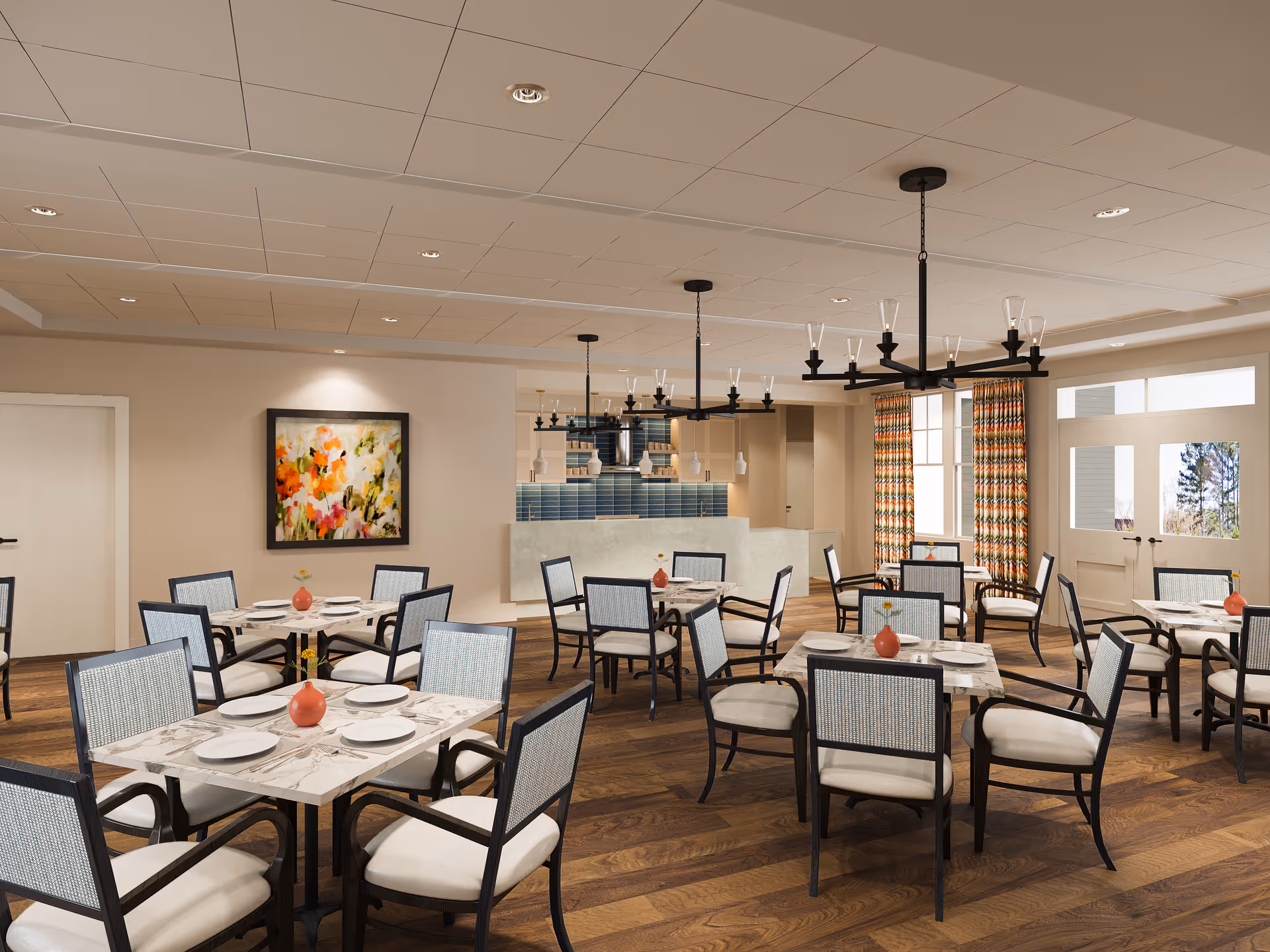 Spacious dining room with multiple set tables and chairs, chandeliers, a serving counter, patterned curtains, and wall artwork.