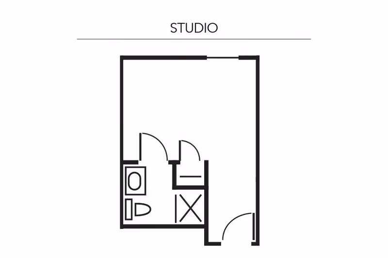 Floor plan layout of a studio apartment showing a main living area, a bathroom with a toilet and sink, and a closet space.