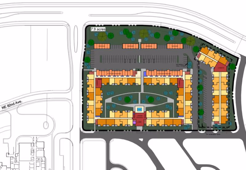 Architectural site plan of Liberty at Shoal Creek facility showing building layouts, parking areas, green spaces with trees, pathways, and labeled sections including garages, pool, lounge, and library.