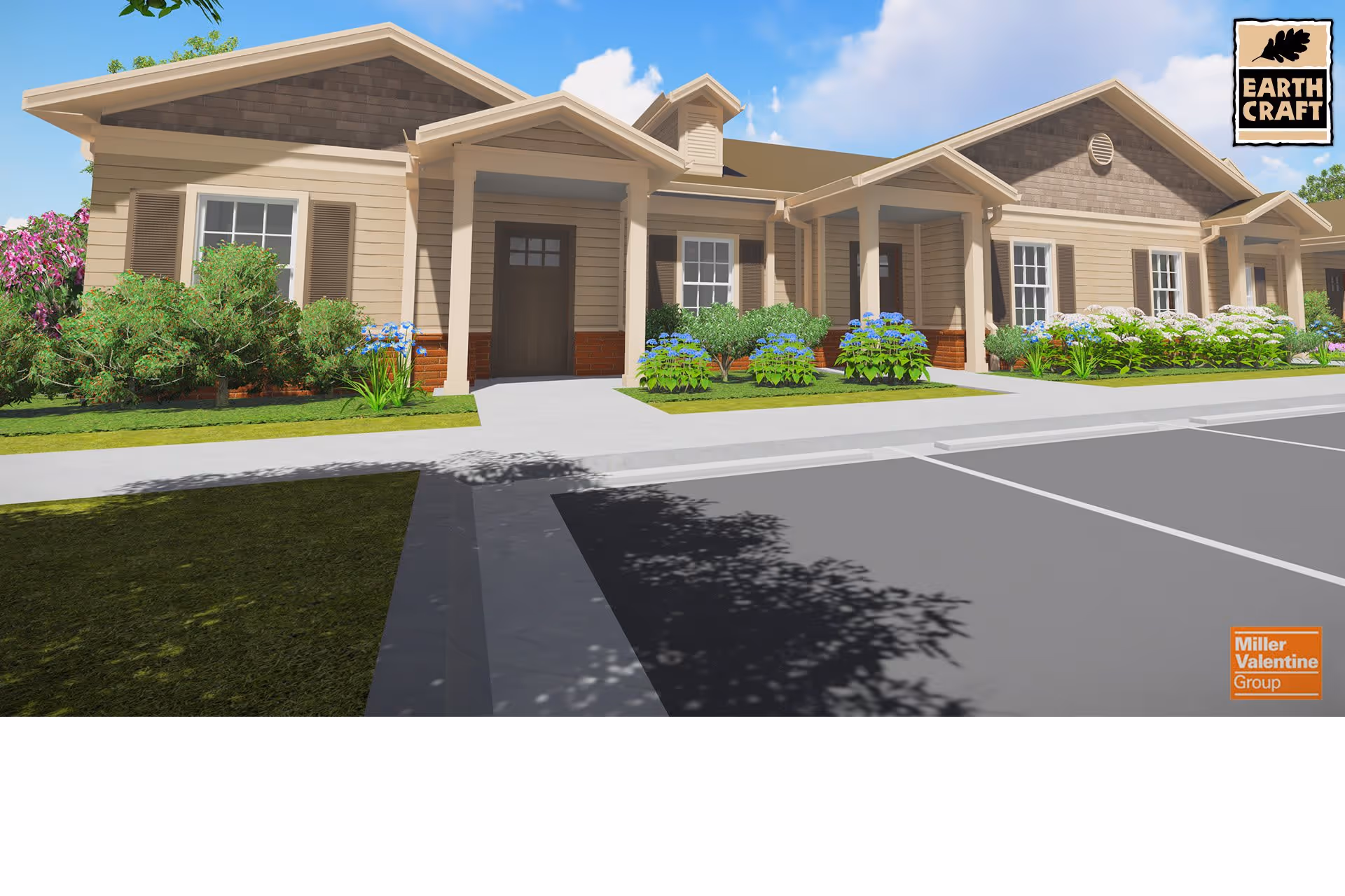 Exterior view of a single-story senior living facility building with beige siding, brown shutters, and a covered entrance. The building is surrounded by green shrubs and colorful flowers, with a paved parking area in front under a blue sky with some clouds.