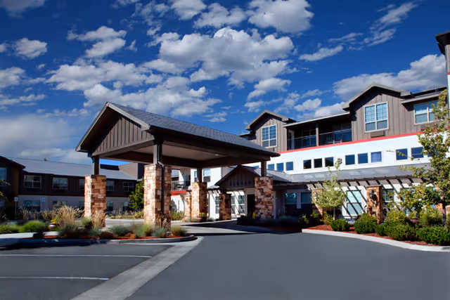 MorningStar of Sparks exterior shows a modern entrance with a porte-cochere and blue sky.