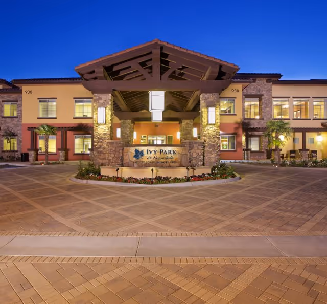 Front view of Ivy Park at Escondido entrance with stone pillars.