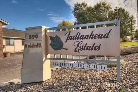 Outdoor sign for Indianhead Estates Residential Care Facility at the entrance.