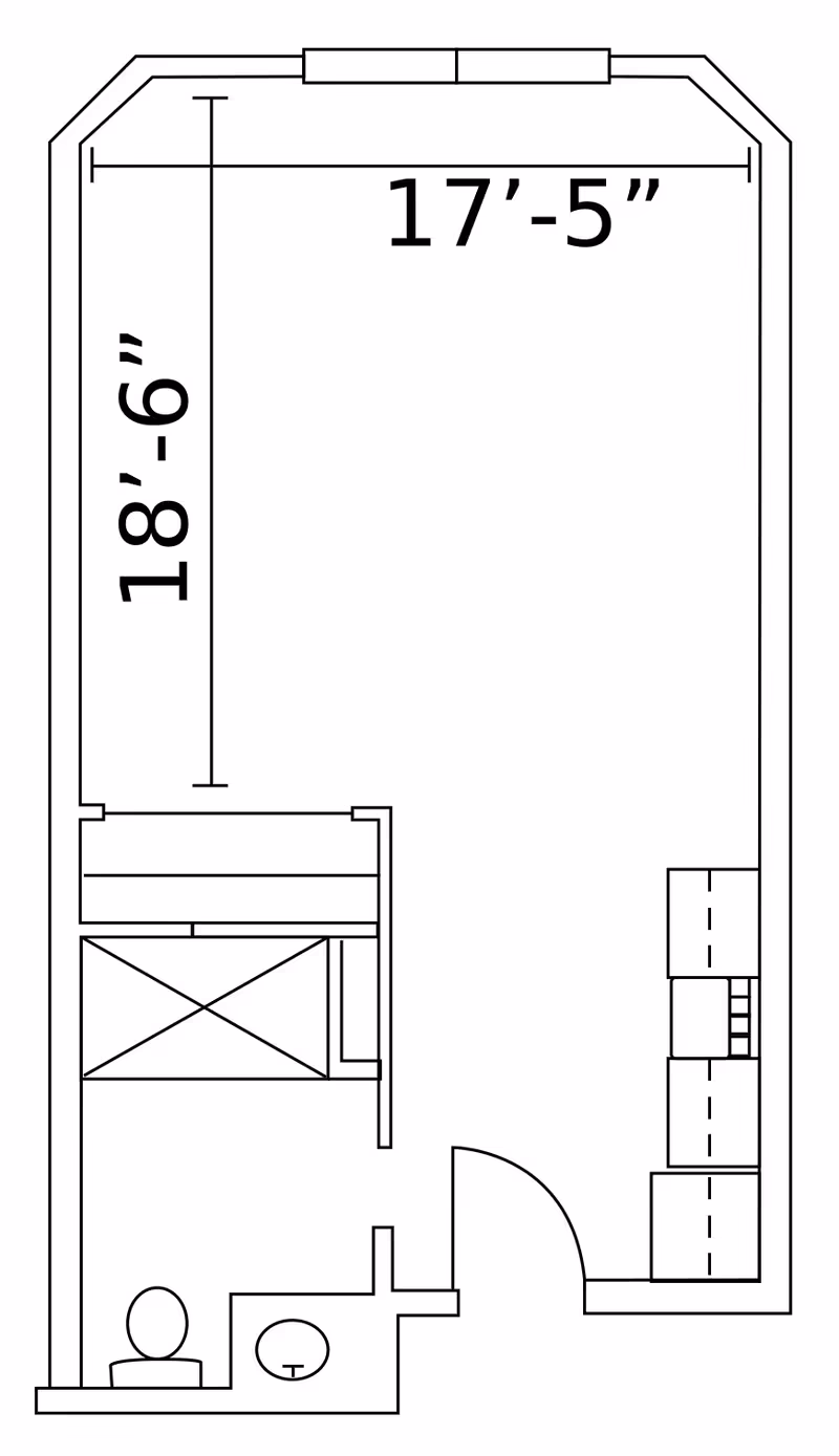Architectural floor plan of a room measuring 17 feet 5 inches by 18 feet 6 inches, showing a bed, a small bathroom with a toilet and sink, and a kitchenette area with cabinets and appliances.