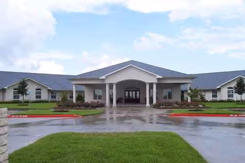 Front exterior of Regent Care Center of League City with a covered entrance and parking.