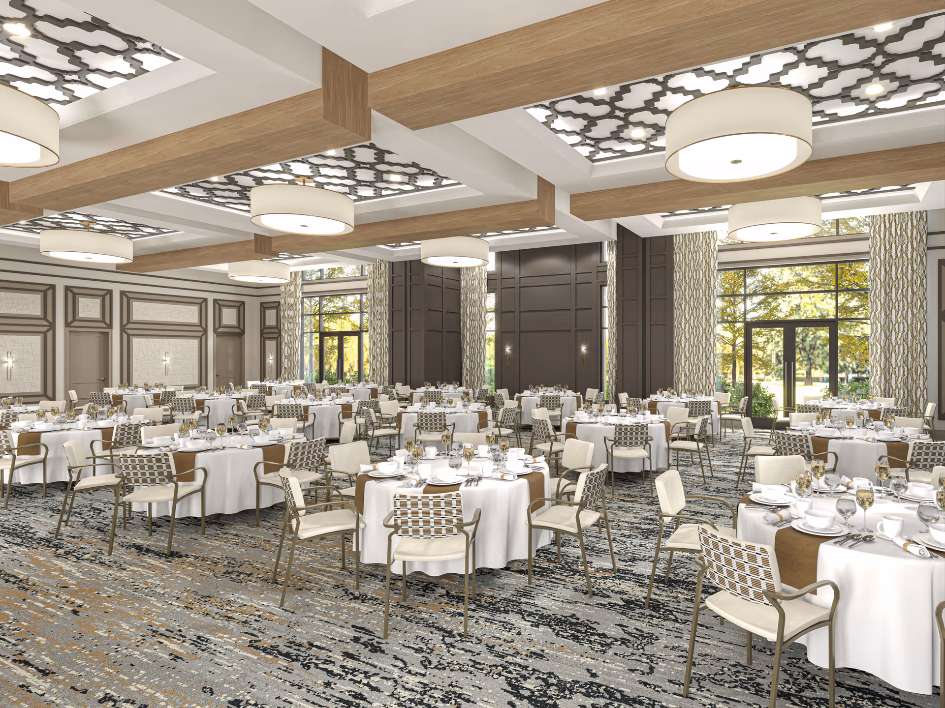 Spacious banquet dining room with round tables set for a meal, modern chandeliers, and large windows overlooking greenery.