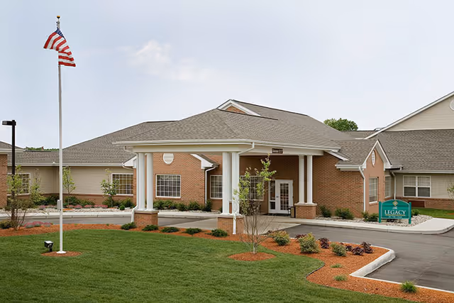 Avalon Springs Health Campus exterior entrance with flagpole and landscaped lawn