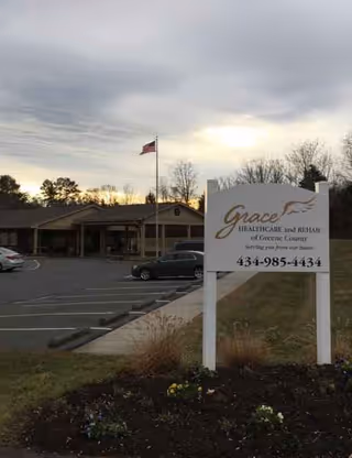 Exterior view of Grace HealthCare and Rehab Center sign and parking lot.