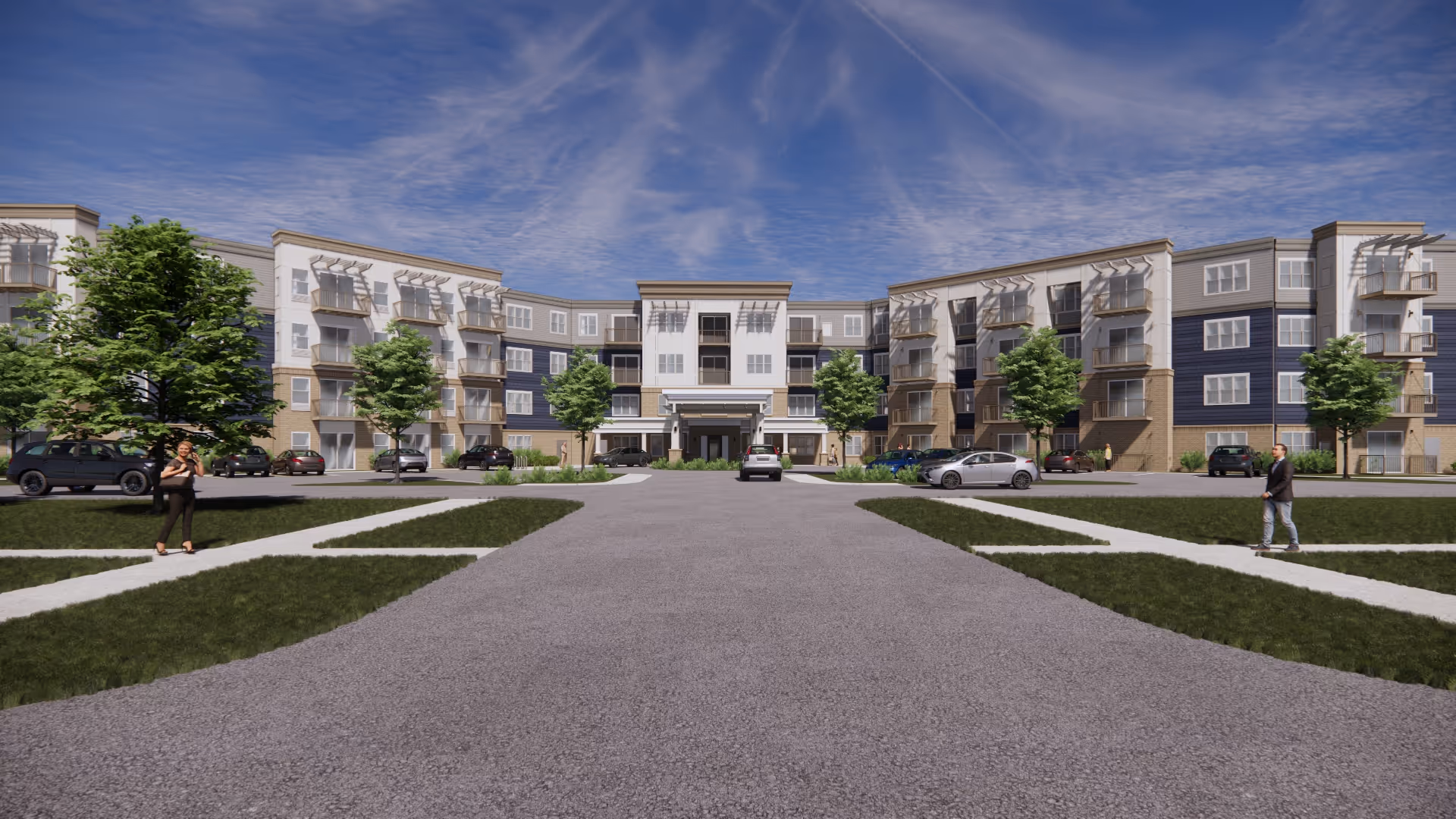 Front exterior view of a modern four-story senior living facility building with multiple windows and balconies. There are trees and parked cars along the driveway leading to the entrance. Two people are walking on the sidewalks on either side of the driveway under a partly cloudy blue sky.