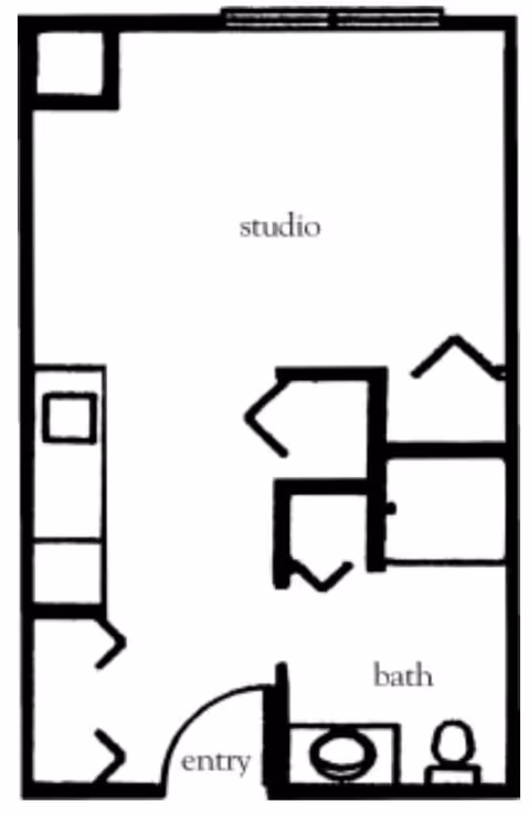 Black and white floor plan of a studio apartment with an entry area, a bathroom with a toilet and sink, and an open studio space.