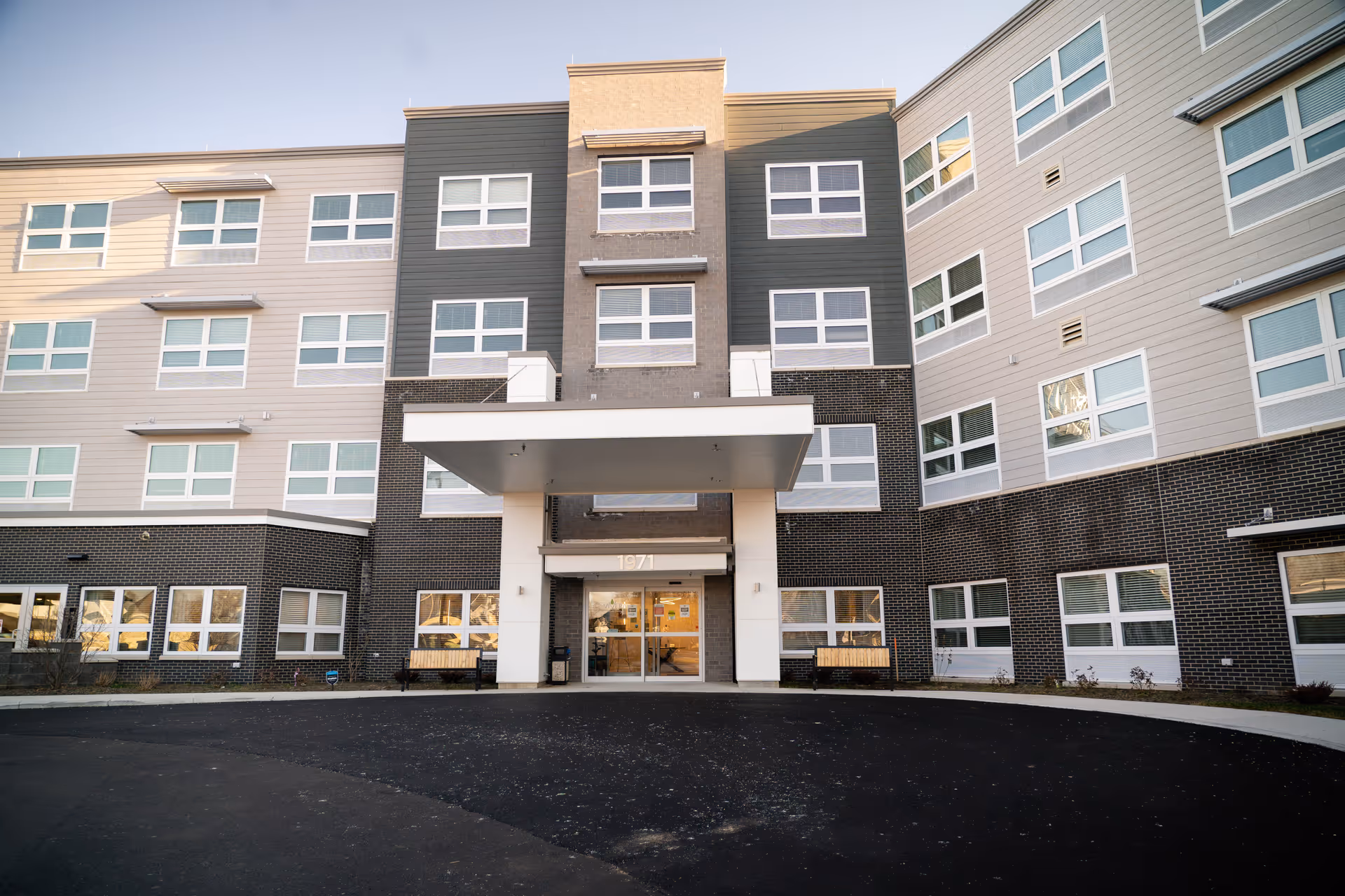 Exterior view of Vivera Senior Living of Columbus showing main entrance and surrounding windows.