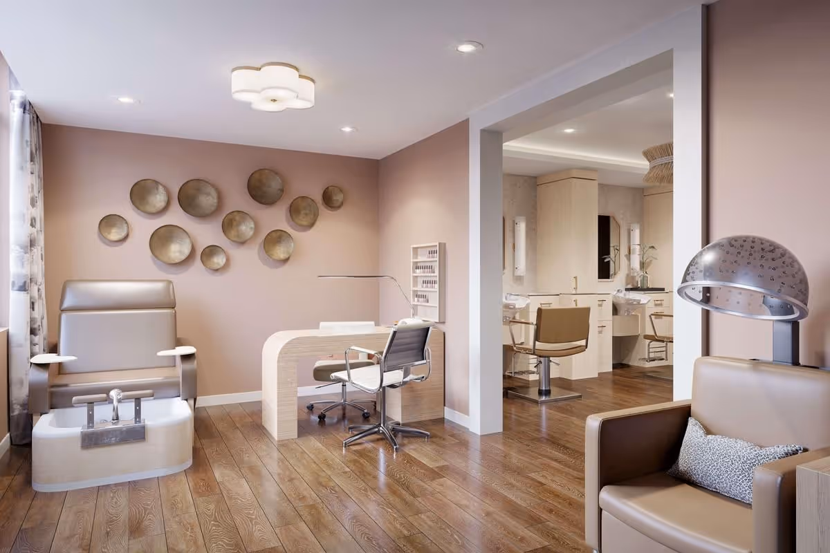 Spa-style salon interior with a pedicure chair, manicure table, styling stations, and seating in soft pink and neutral tones.