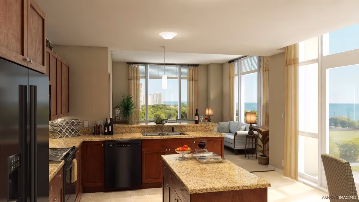 Bright and spacious kitchen with granite countertops, wooden cabinets, and black appliances including a refrigerator, stove, and dishwasher. The kitchen opens into a living area with large windows offering a view of greenery and water outside. The living area has a small sofa, side tables with lamps, and light-colored curtains.