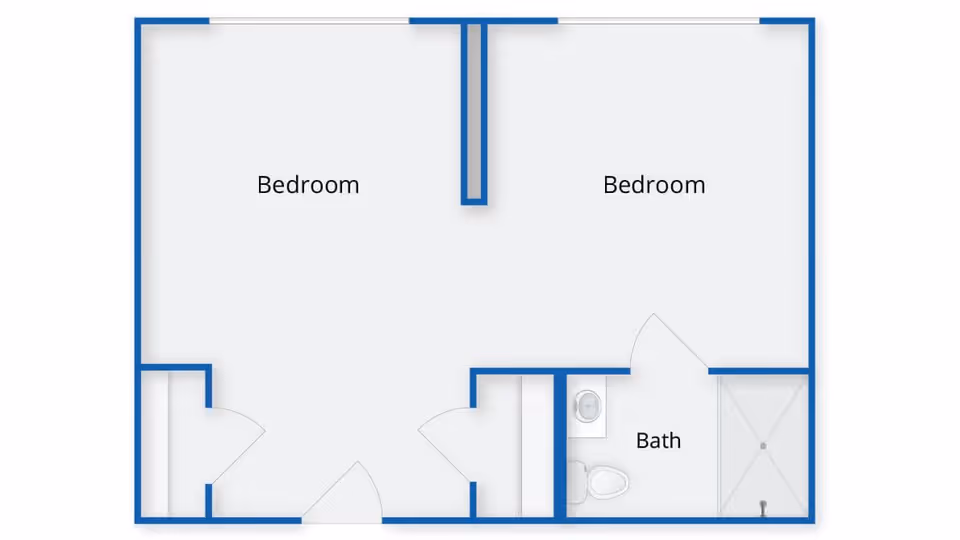 Floor plan showing two bedrooms and one bathroom with a shower, toilet, and sink.
