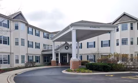 Senior living facility with a covered entrance and circular driveway.