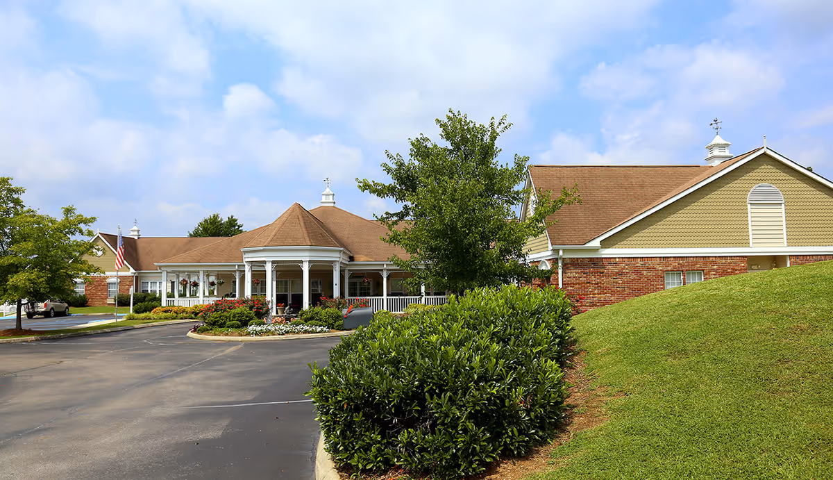 Exterior view of The Neighborhood at Cullman front entrance with parking and landscaping.
