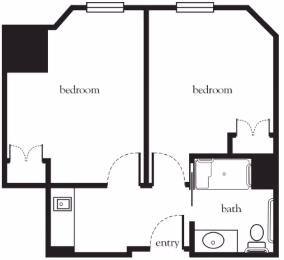 Floor plan layout showing two bedrooms, one bathroom, and an entry area. The bathroom includes a bathtub, sink, and toilet. Each bedroom has a closet space.