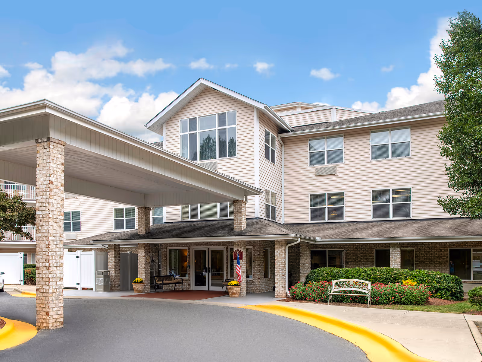 Solista Durham senior living facility exterior with covered entrance and manicured landscaping