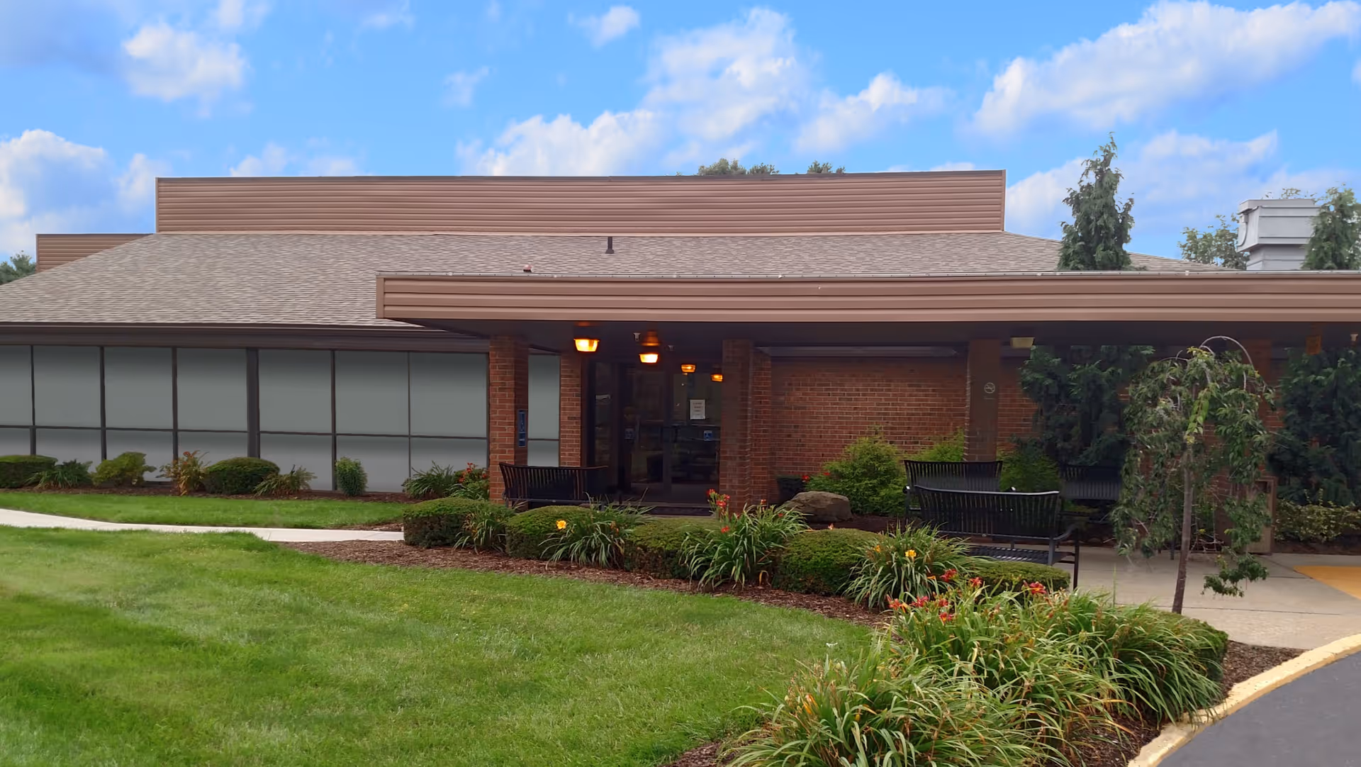 Exterior view of the Arbors at Minerva senior living facility with landscaping.