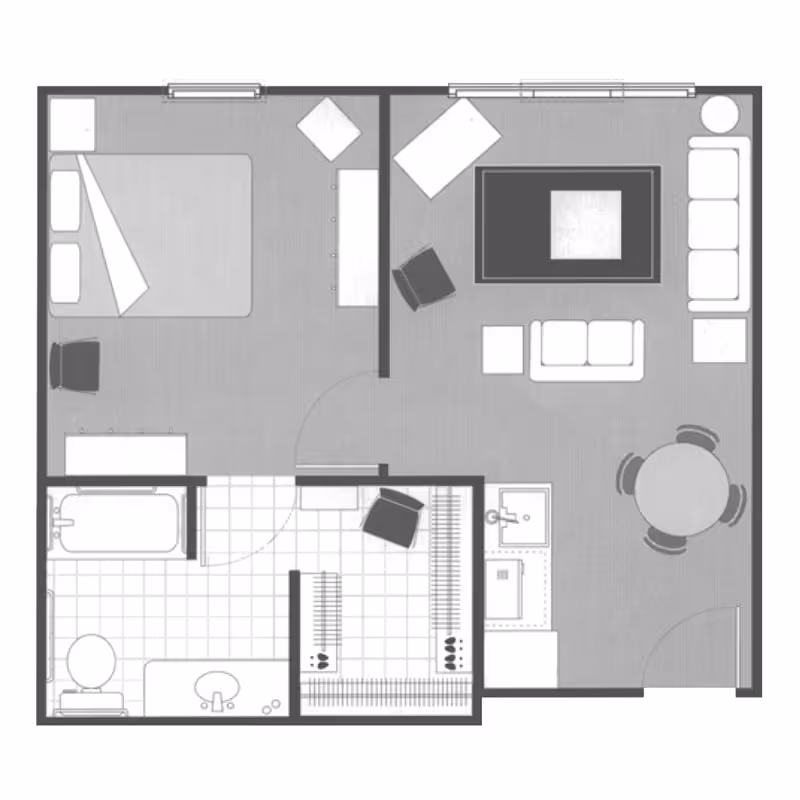 Floor plan of a one-bedroom apartment featuring a bedroom with a bed and chair, a living room with sofas, chairs, a coffee table, and a round dining table with four chairs, a kitchen area with a sink, and a bathroom with a bathtub, toilet, and sink. There is also a closet area near the entrance.