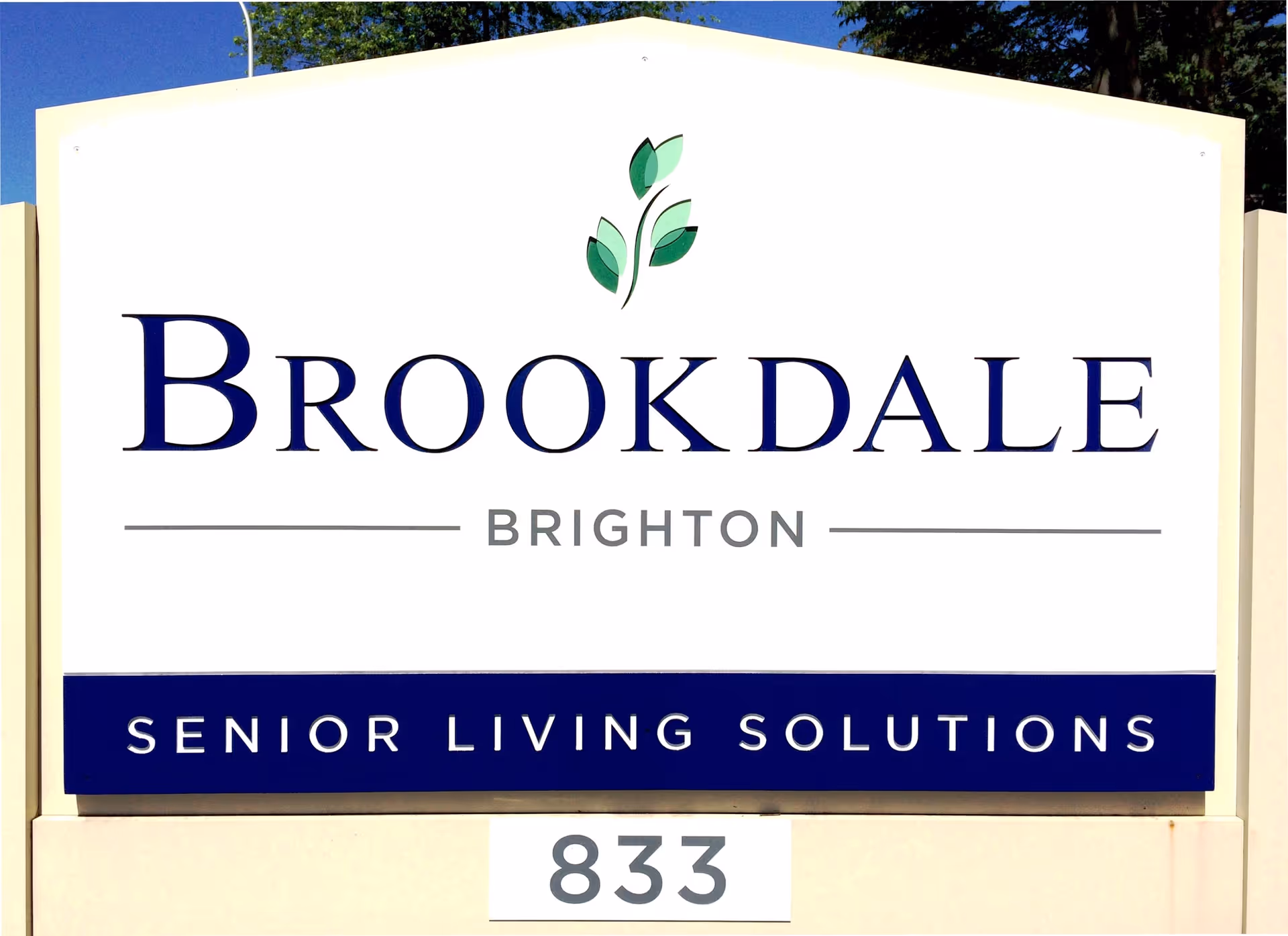 A large outdoor sign for Brookdale Brighton Senior Living Solutions with the number 833 displayed below it.