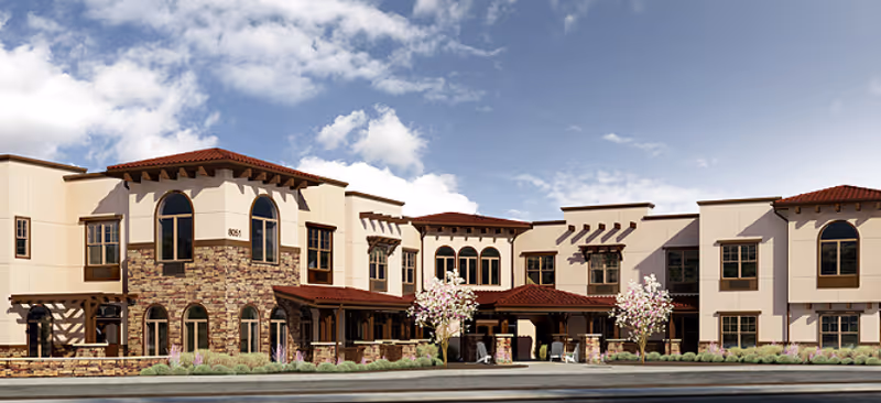 Exterior view of MorningStar Assisted Living & Memory Care of Albuquerque building with arched windows