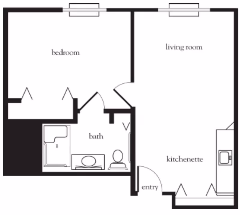 Floor plan layout of a senior living unit at Vitality Living Lake Forest showing a bedroom, bath with shower, toilet and sink, living room, kitchenette, and entry area.