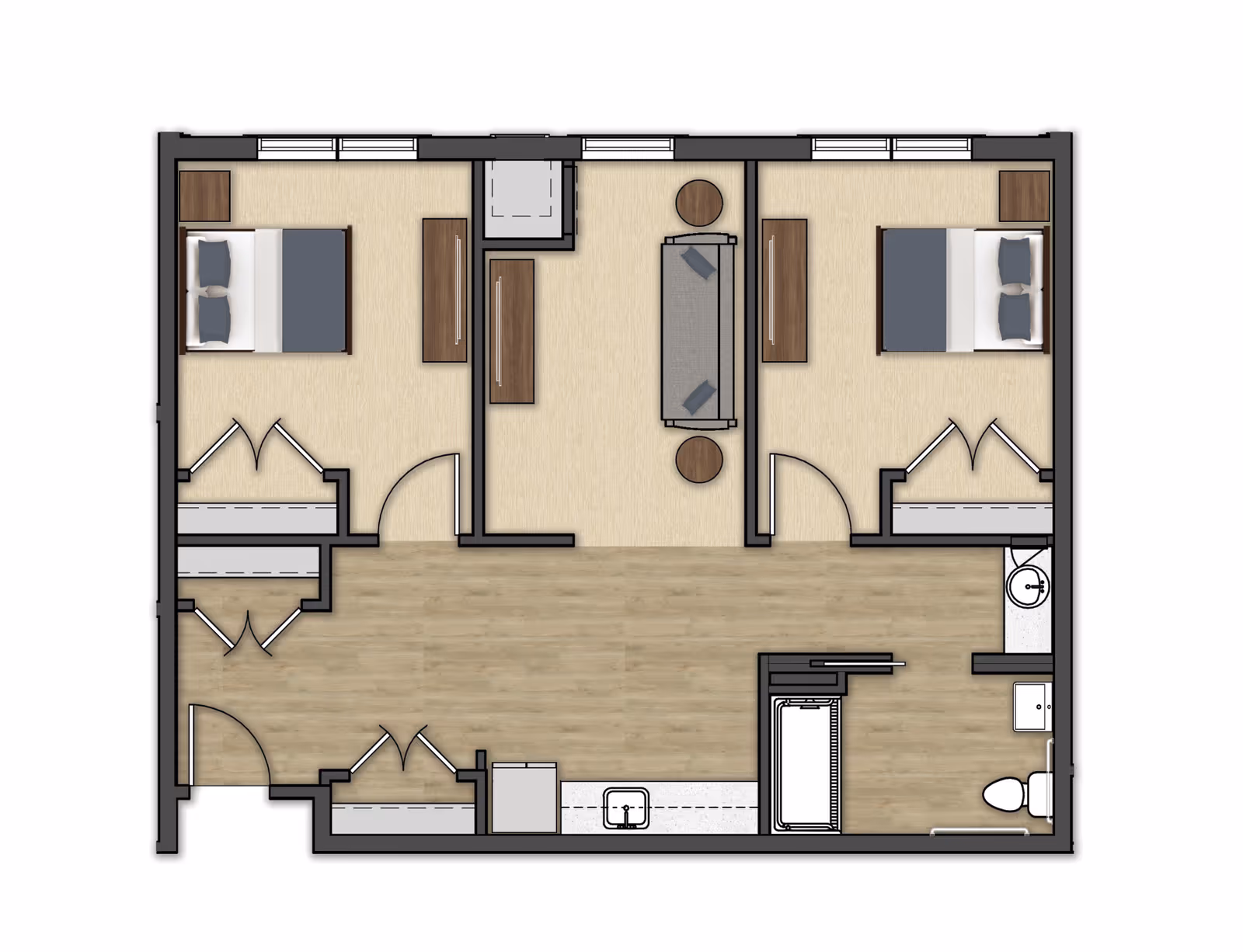 Floor plan of a senior living unit at The Chelsea at West Orange showing two bedrooms, a living area with a sofa and two side tables, a kitchen area with a sink, and a bathroom with a bathtub, toilet, and sink.