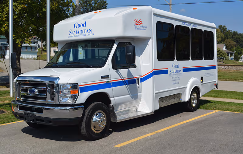 White Good Samaritan Home and Rehabilitative Center shuttle bus parked in a parking lot.