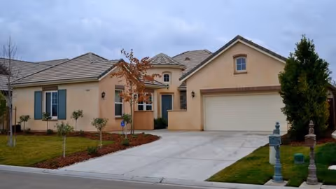 Front view of a single-story residential building with a two-car garage.