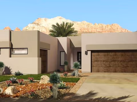 Modern desert-style assisted living facility exterior with palm trees and rocky landscaping.