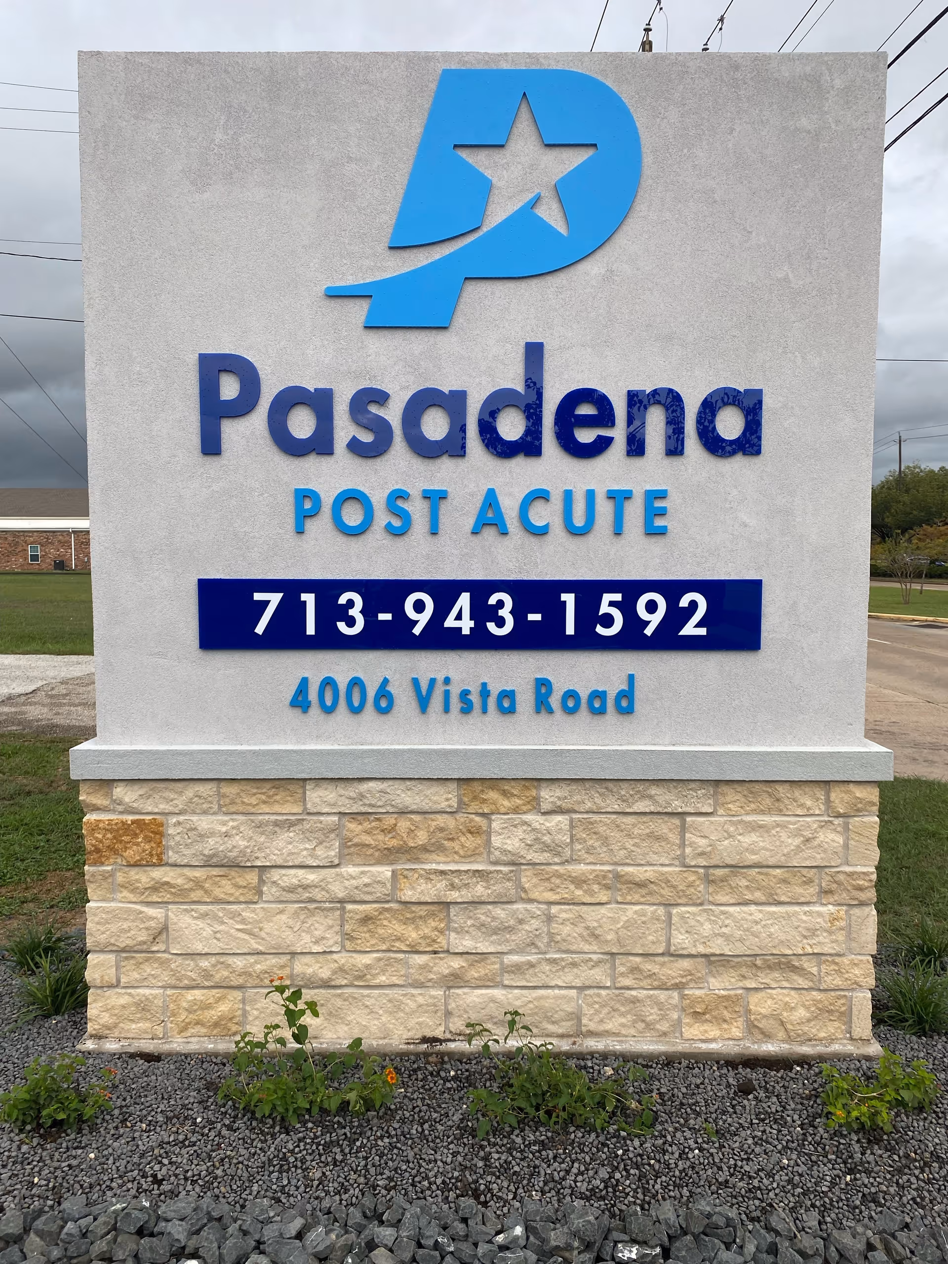 Monument sign for Pasadena Post Acute displaying a logo, phone number 713-943-1592, and address 4006 Vista Road.