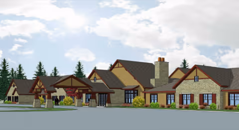Exterior view of Maplewood at Cuyahoga Falls facility with stone walls and peaked roofs