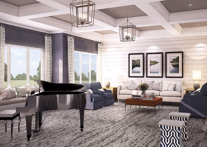 A spacious and well-lit living room featuring a black grand piano with a matching bench, multiple seating options including a long beige sofa, two blue armchairs, and a blue couch. The room has large windows with patterned curtains, a wooden coffee table with decorative items, three framed landscape pictures on the wall, and two geometric-patterned stools. The ceiling has recessed lighting and two modern pendant lights.