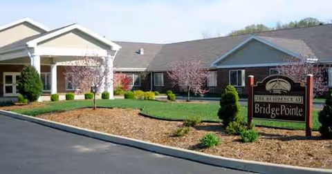 Exterior view of BridgePointe Health Campus with landscaped front and sign.