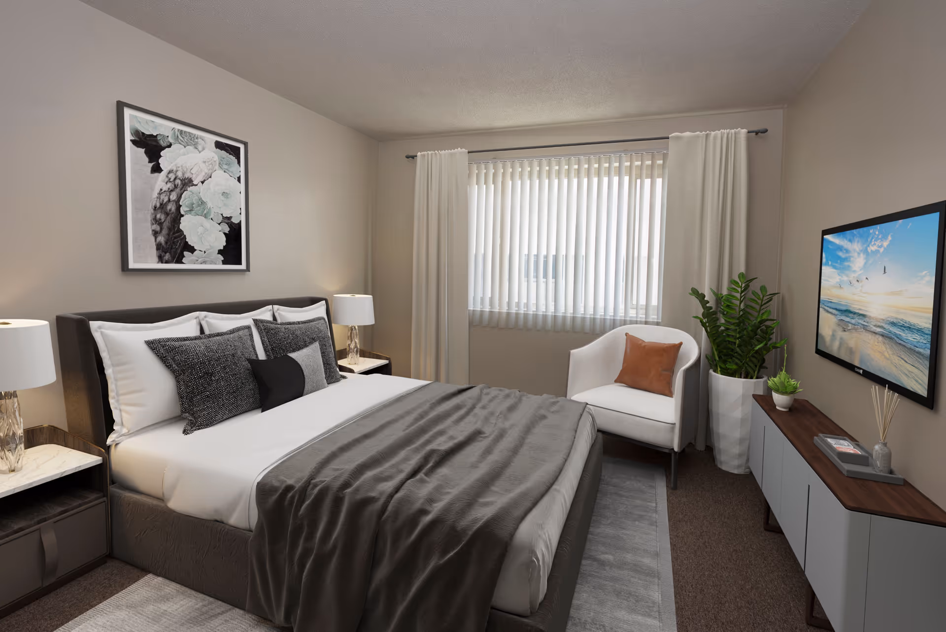 Well-lit furnished bedroom with a made bed, pillows and throw, an armchair by a curtained window, TV on a console, and a potted plant.