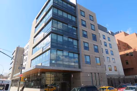 Exterior view of Henry J Carter Skilled Nursing Facility with glass-front entrance.