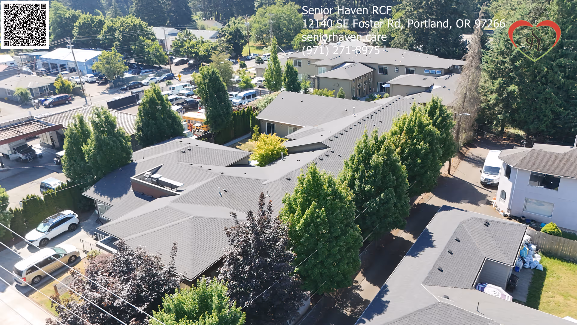 Aerial view of the Senior Haven RCF building complex showing rooftops, trees, parked cars and surrounding streets.
