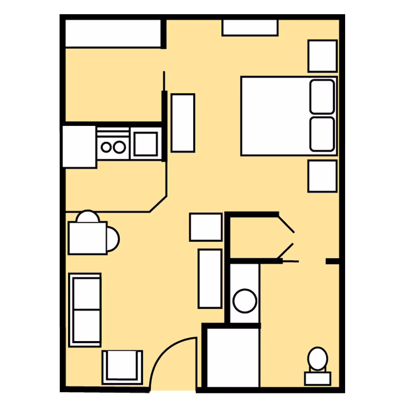 Floor plan of a senior living unit at Benton Village of Stockbridge showing a combined living and dining area with sofa, chair, and table, a kitchen with stove and sink, a bedroom with a bed and nightstands, and a bathroom with a toilet and sink.