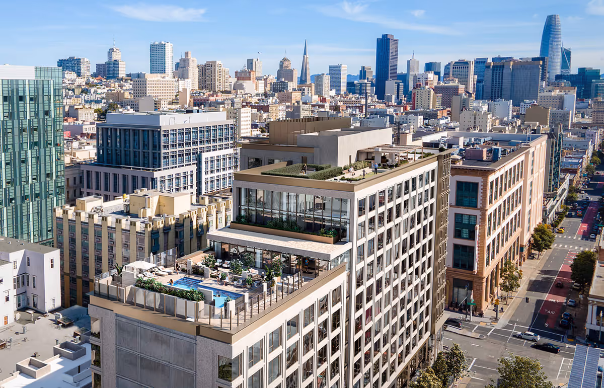 Aerial view of a modern multi-story building with rooftop amenities including a swimming pool, lounge areas, and green spaces, set against a city skyline with numerous high-rise buildings under a clear blue sky.